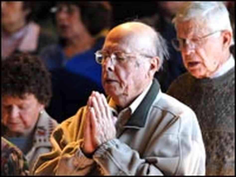 Churchgoers at Assumption of Blessed Virgin Mary Parish in Roswell, N.M., pray.