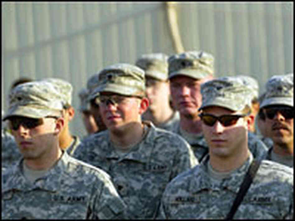 U.S. troops listen to a briefing
