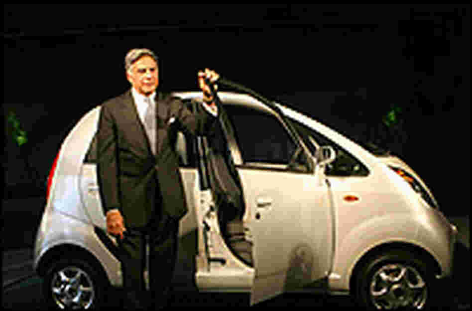 Tata Group Chairman Ratan Tata poses with the Nano.