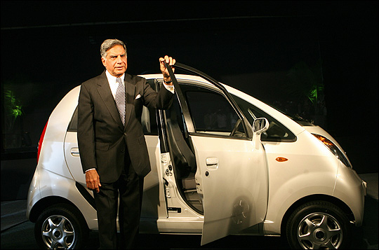 Tata Group Chairman Ratan Tata poses with the Nano.