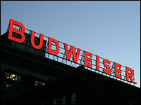 A Budweiser sign sits atop one of the buildings at the Anheuser-Busch brewery in St. Louis.