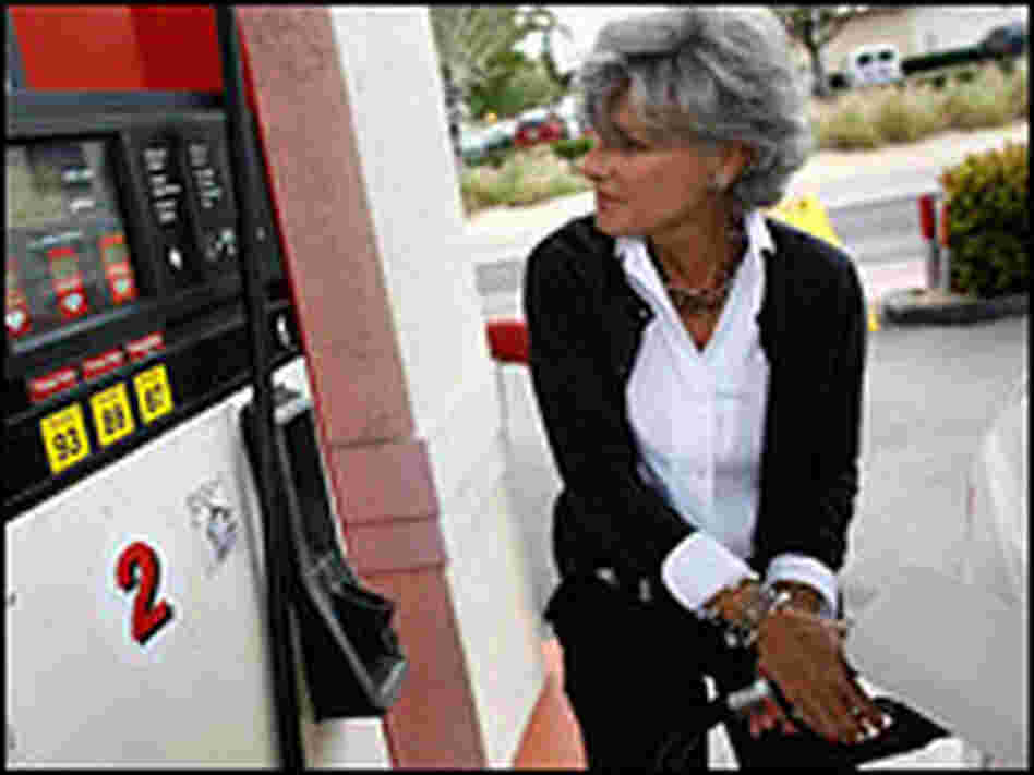 Nikki Baron fuels her vehicle at a gas station in Miami Beach, Fla.