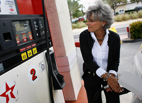 Nikki Baron fuels her vehicle at a gas station in Miami Beach, Fla.