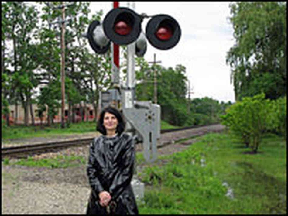 Barrington Village President Karen Darch stands at one of the EJ&E crossings in her town.