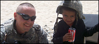 Bogar with a boy in Afghanistan.