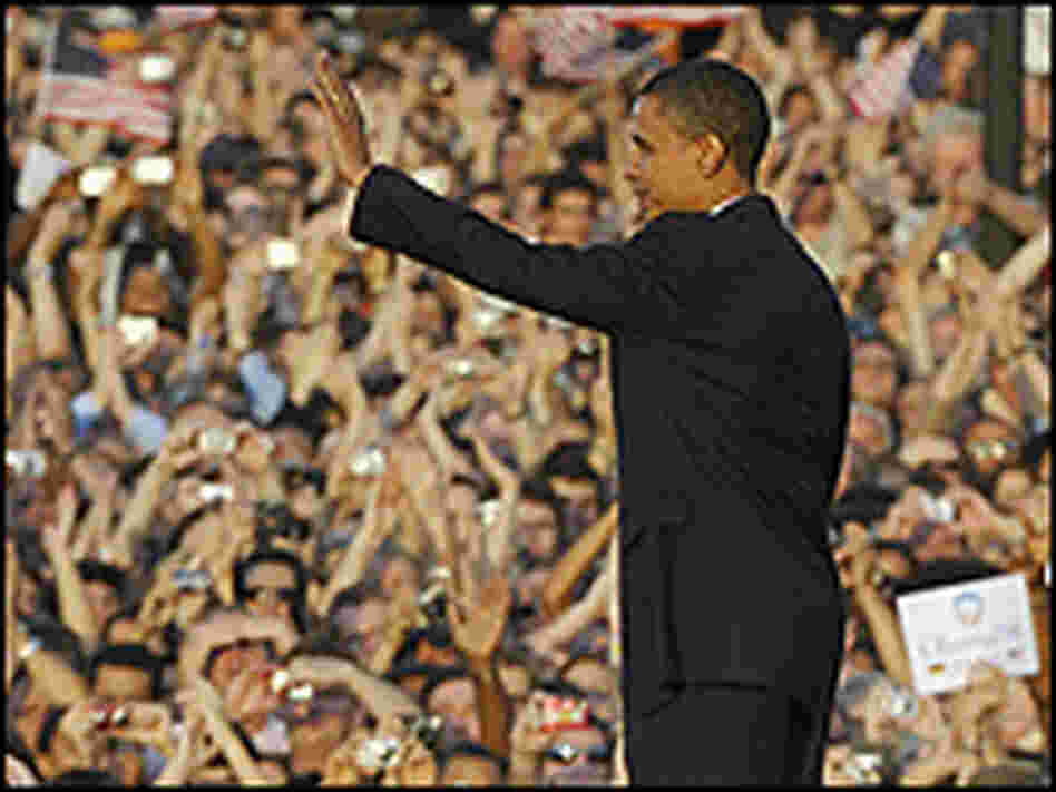 Sen. Barack Obama waves to the crowd after making a speech in front of the Victory Column in Berlin.