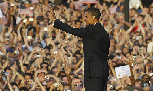 Sen. Barack Obama waves to the crowd after making a speech in front of the Victory Column in Berlin.