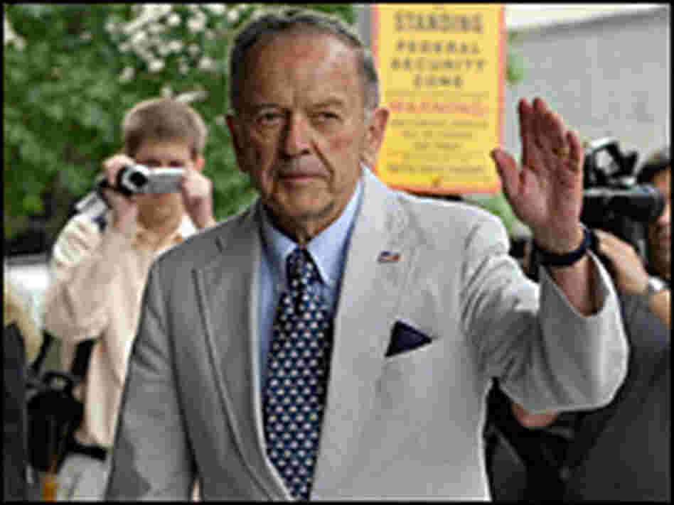 U.S. Sen. Ted Stevens waves to cameras as he arrives at the U.S. District Court in Washington, D.C.