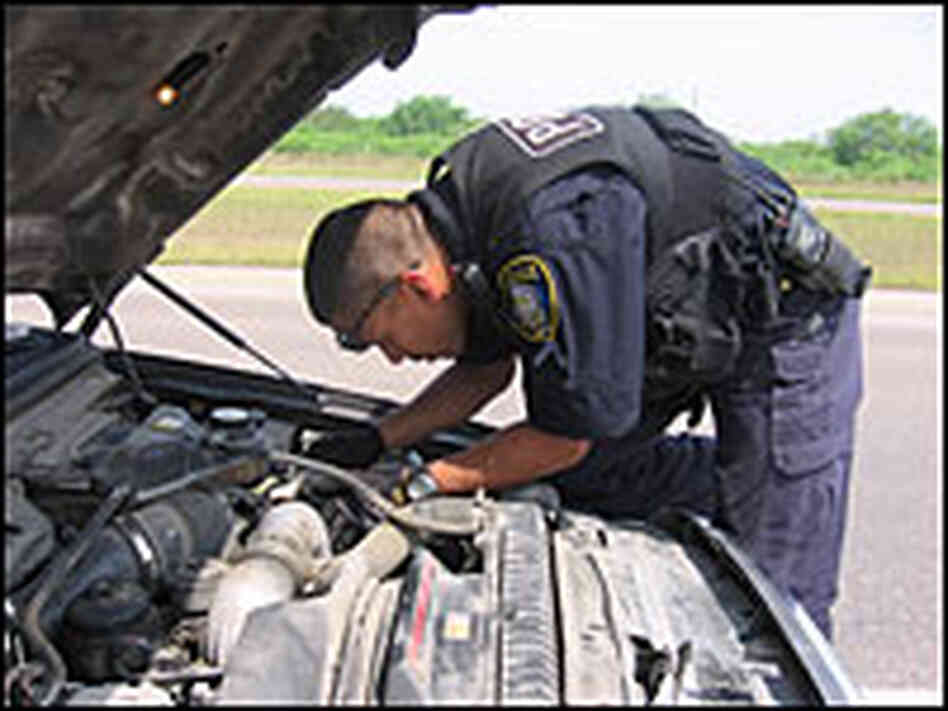Mike Tamez under the hood searching for money.