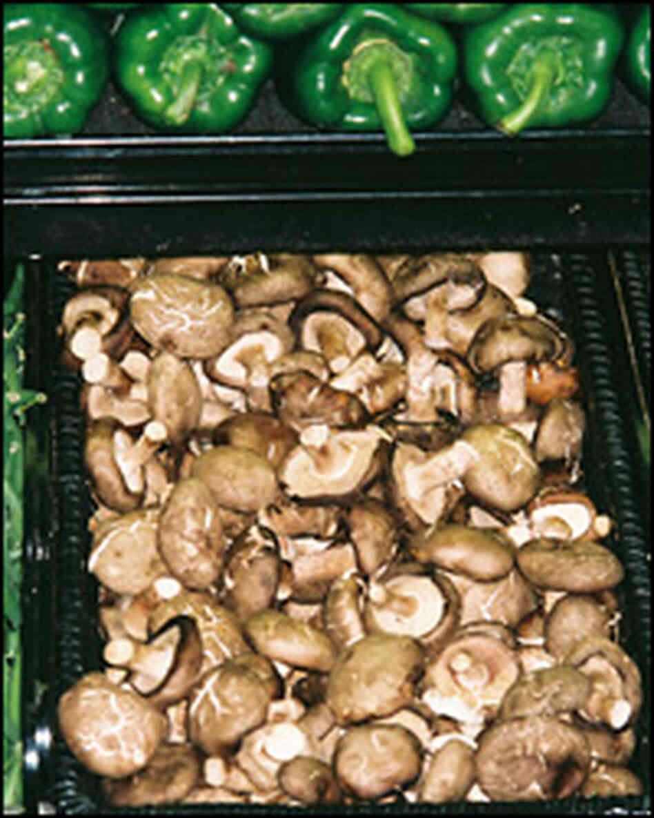 A supermarket bin gives no hint of the mushrooms' origin, leaving consumers in the dark.