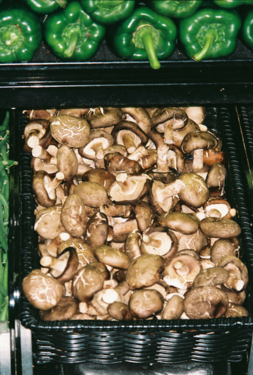 A supermarket bin gives no hint of the mushrooms' origin, leaving consumers in the dark.