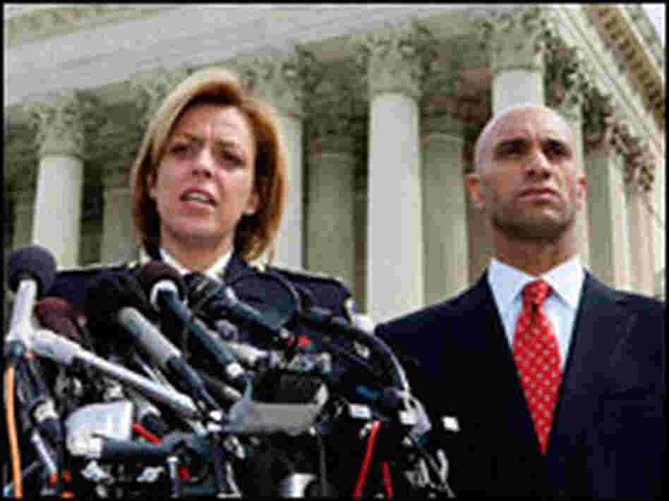 Police Chief Cathy Lanier and District of Columbia Mayor Adrian Fenty speak to reporters.