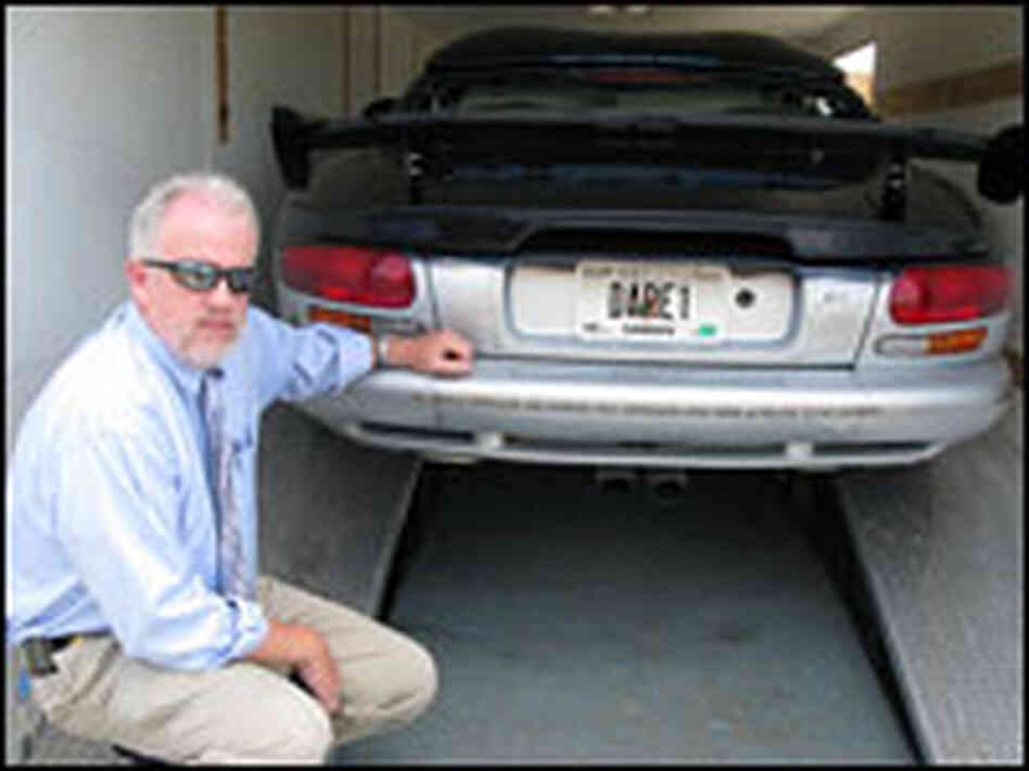 Lt. William Terrell with the DARE vehicle.