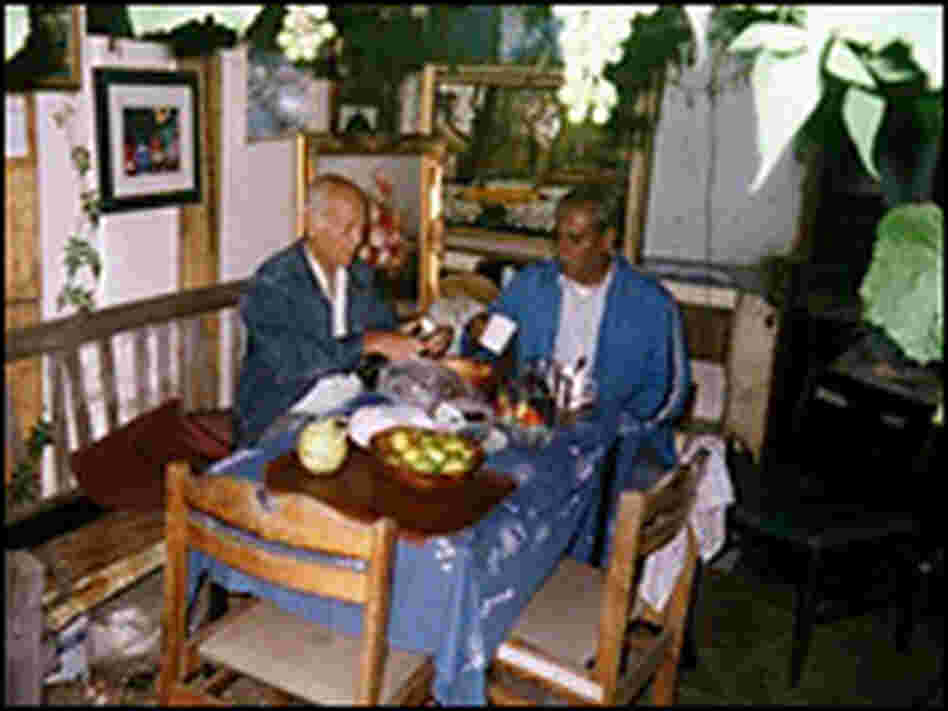 Hassan and Reg share a Sunday lunch in Hassan's shed at Manor Gardens in 2006. Hassan and Reg share a Sunday lunch in Hassan's shed at Manor Gardens in 2006.