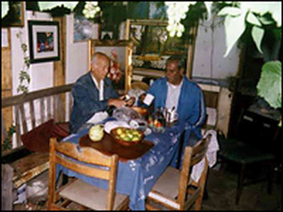 Hassan and Reg share a Sunday lunch in Hassan's shed at Manor Gardens in 2006. Hassan and Reg share a Sunday lunch in Hassan's shed at Manor Gardens in 2006.