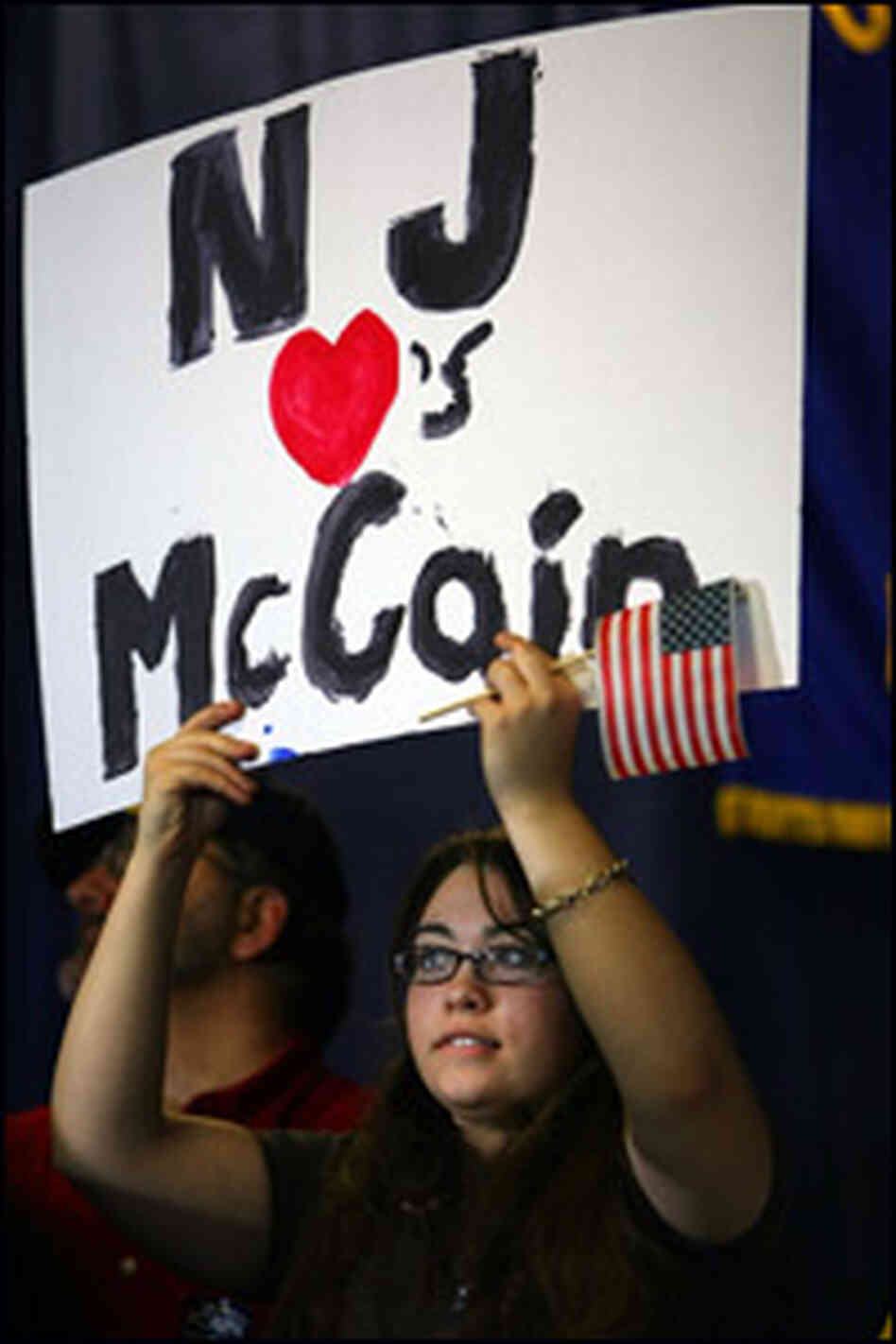 A McCain supporter holds a sign at a rally on Feb. 4 in New Jersey. A McCain supporter holds a sign at a rally on Feb. 4 in New Jersey.