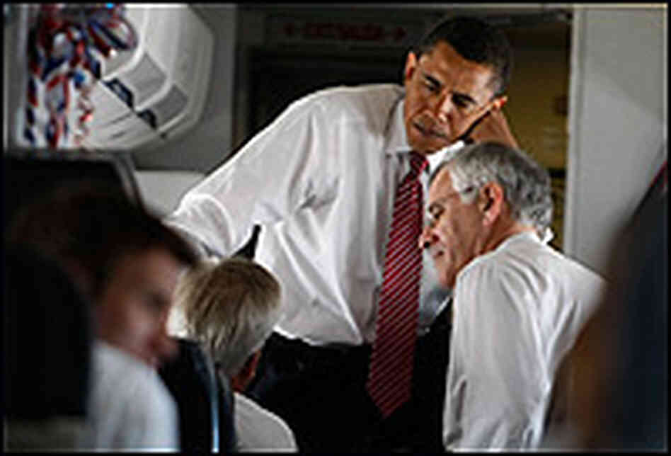 A senior adviser to Obama, Richard Danzig, talks to the candidate on a plane. A senior adviser to Obama, Richard Danzig, talks to the candidate on a plane.