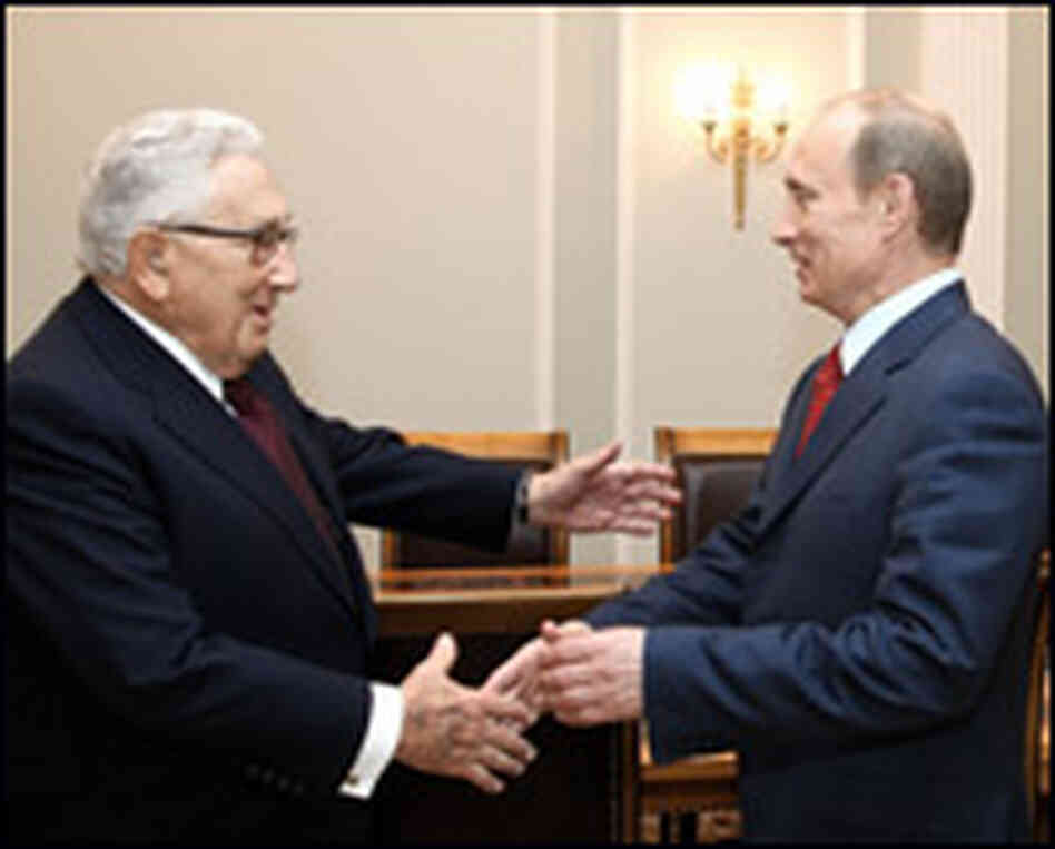 Former U.S. Secretary of State Henry Kissinger shakes hands with the Russian prime minister. Former U.S. Secretary of State Henry Kissinger shakes hands with the Russian prime minister.