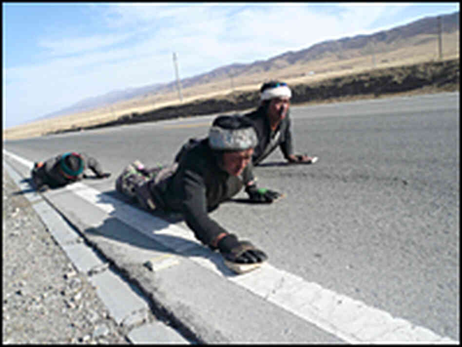 Pilgrims prostrating themselves near Qinghai Lake.