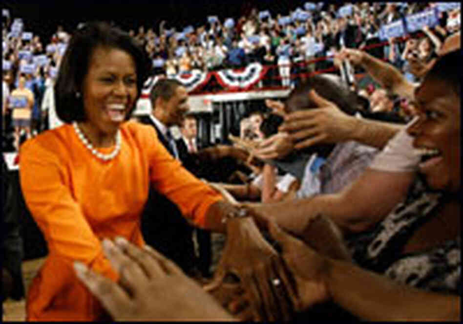 Michelle Obama shakes hands at a rally in North Carolina. Michelle Obama shakes hands at a rally in North Carolina.