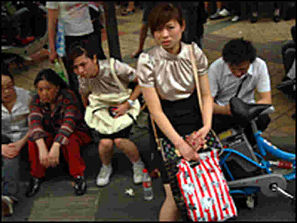 Residents fled buildings for the sidewalks of Chengdu, capital of Sichuan province.
