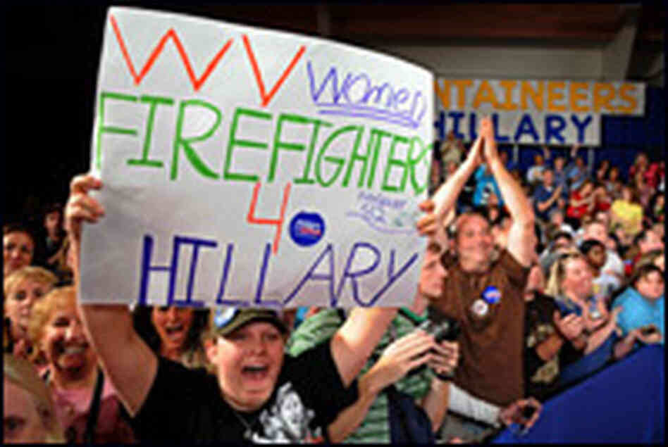 Two young women hold signs supporting New York Sen. Hillary Clinton. Two young women hold signs supporting New York Sen. Hillary Clinton.