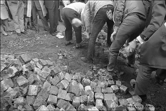 Students dug up cobblestones to throw at police.
