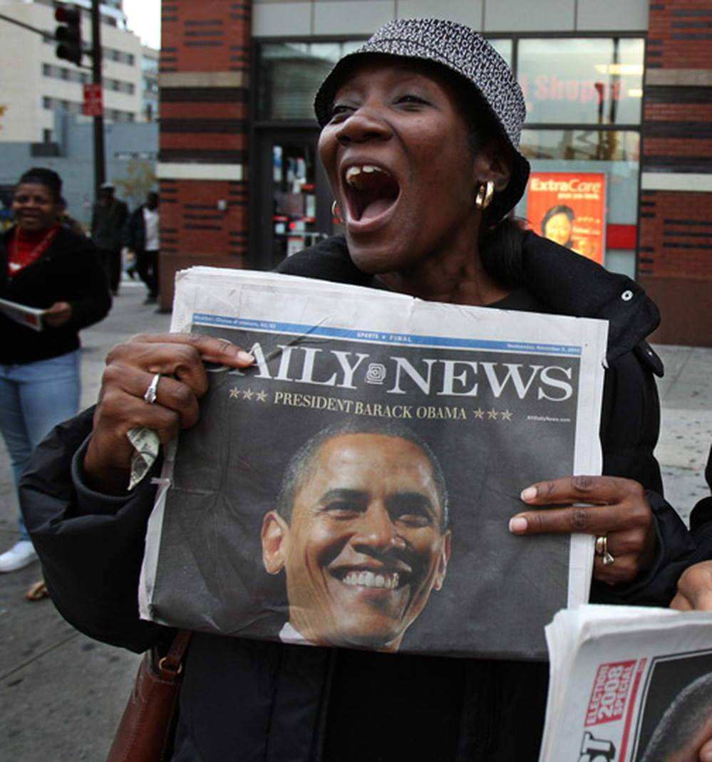 A woman in Harlem expresses her happiness Wednesday following Obama's victory.