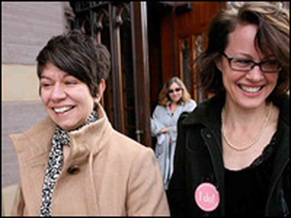 Peg Olivera, left, and Jennifer Vickery walk out of City Hall.