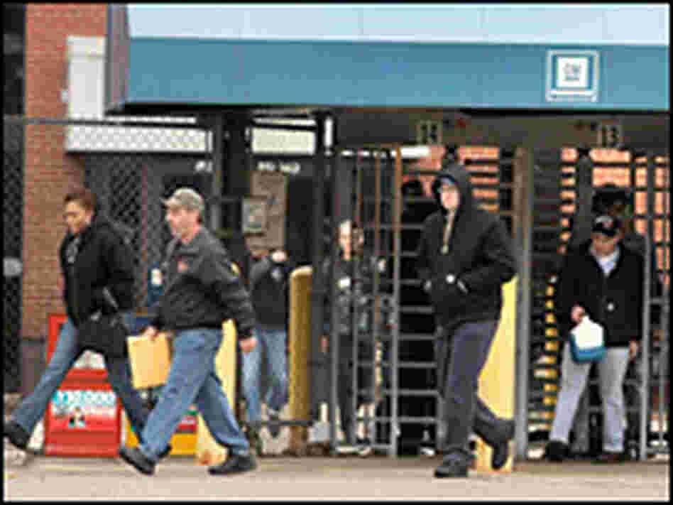 General Motors workers leave the GM Powertrain plant in Warren, Mich.
