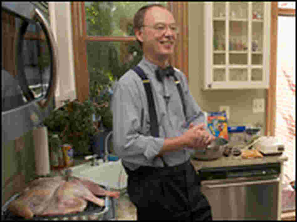 For moist, flavorful dressing, Chris Kimball recommends cooking the turkey over it in a broiling pan