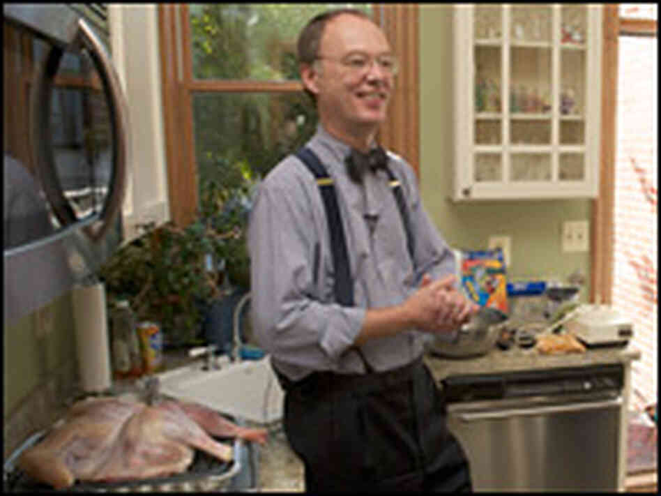 For moist, flavorful dressing, Chris Kimball recommends cooking the turkey over it in a broiling pan
