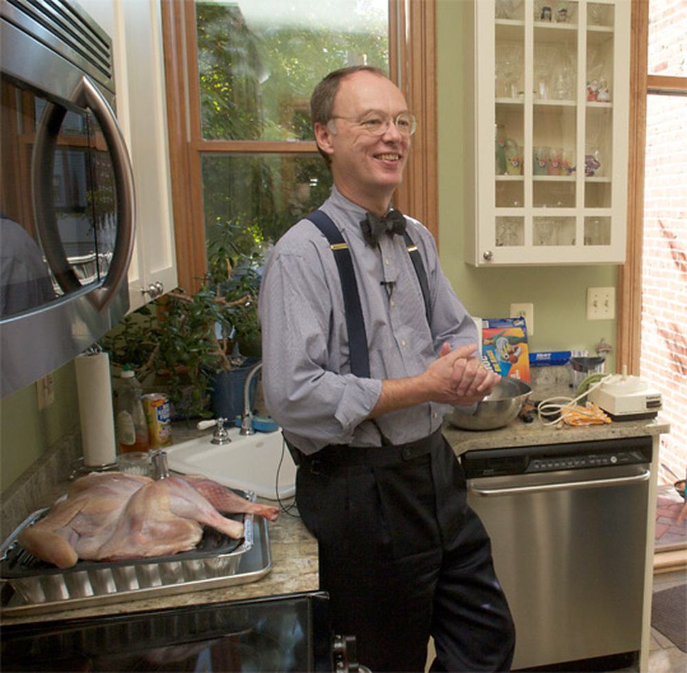 For moist, flavorful dressing, Chris Kimball recommends cooking the turkey over it in a broiling pan