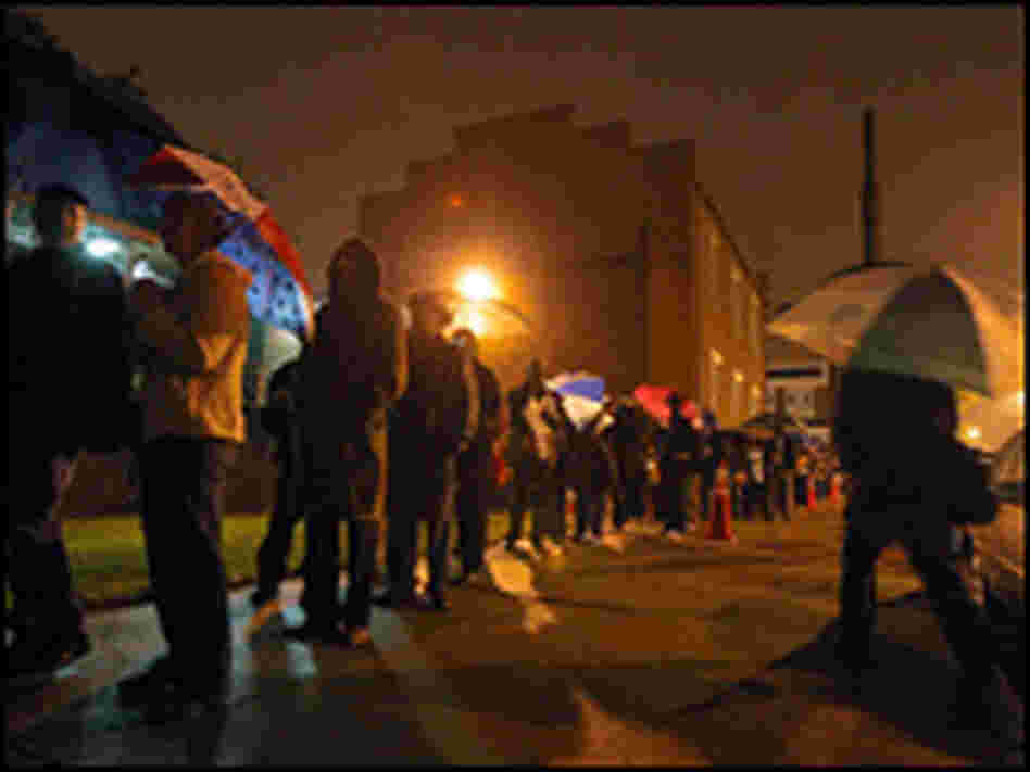 Voters line up before 6 a.m. at a polling place in Richmond, Va.