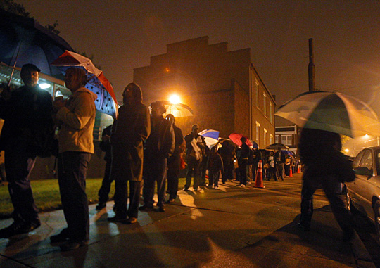 Voters line up before 6 a.m. at a polling place in Richmond, Va.