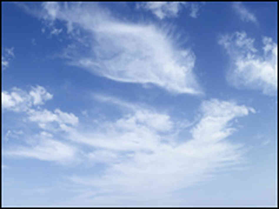 A photo of clouds that could be interpreted as forming an image. A photo of clouds that could be interpreted as forming an image.