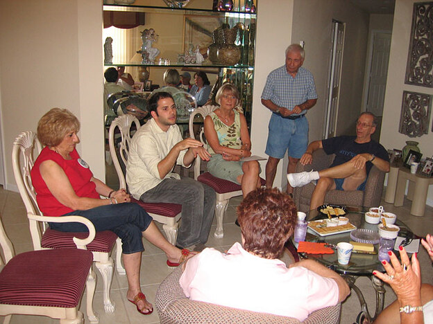 Taylor Magenheim talks with his grandparents and their friends about Barack Obama.