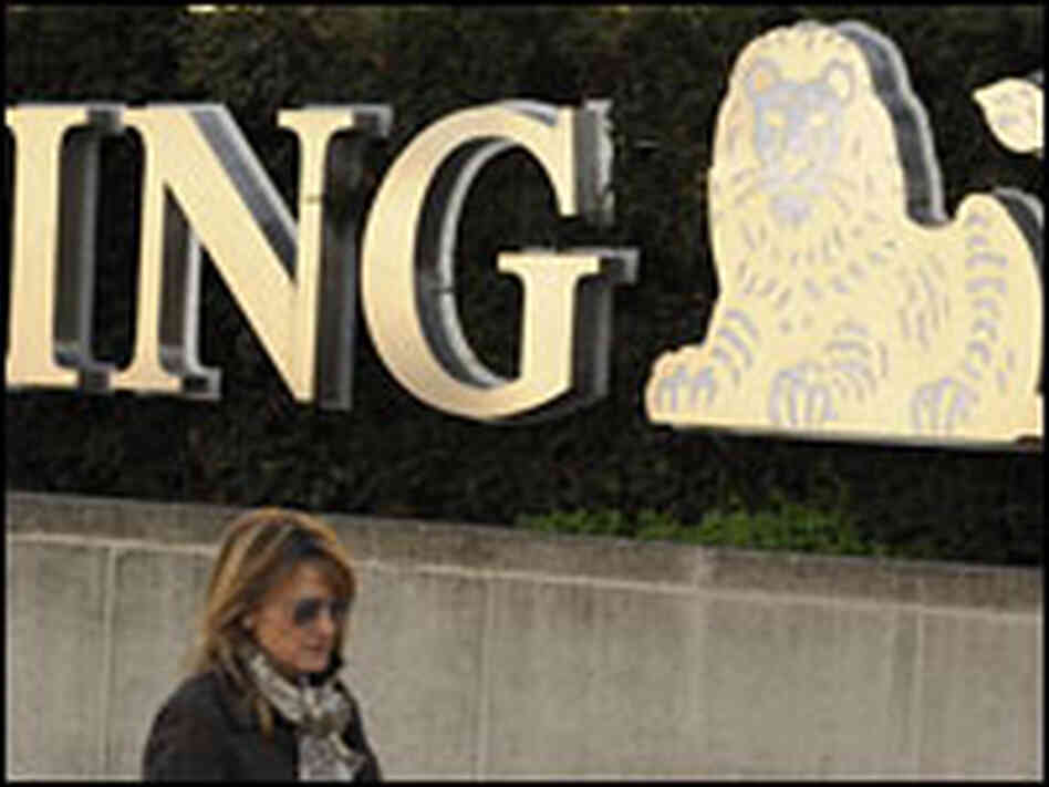 A woman walks in front of a Brussels branch of the banking giant ING.
