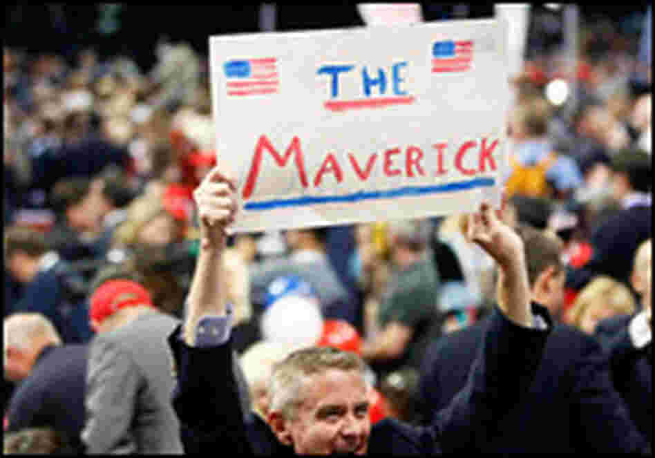 A man at the Republican National Convention holds up a sign reading "The Maverick." A man at the Republican National Convention holds up a sign reading "The Maverick."