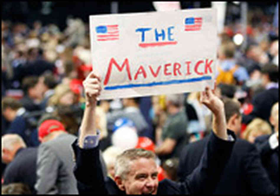 A man at the Republican National Convention holds up a sign reading "The Maverick." A man at the Republican National Convention holds up a sign reading "The Maverick."