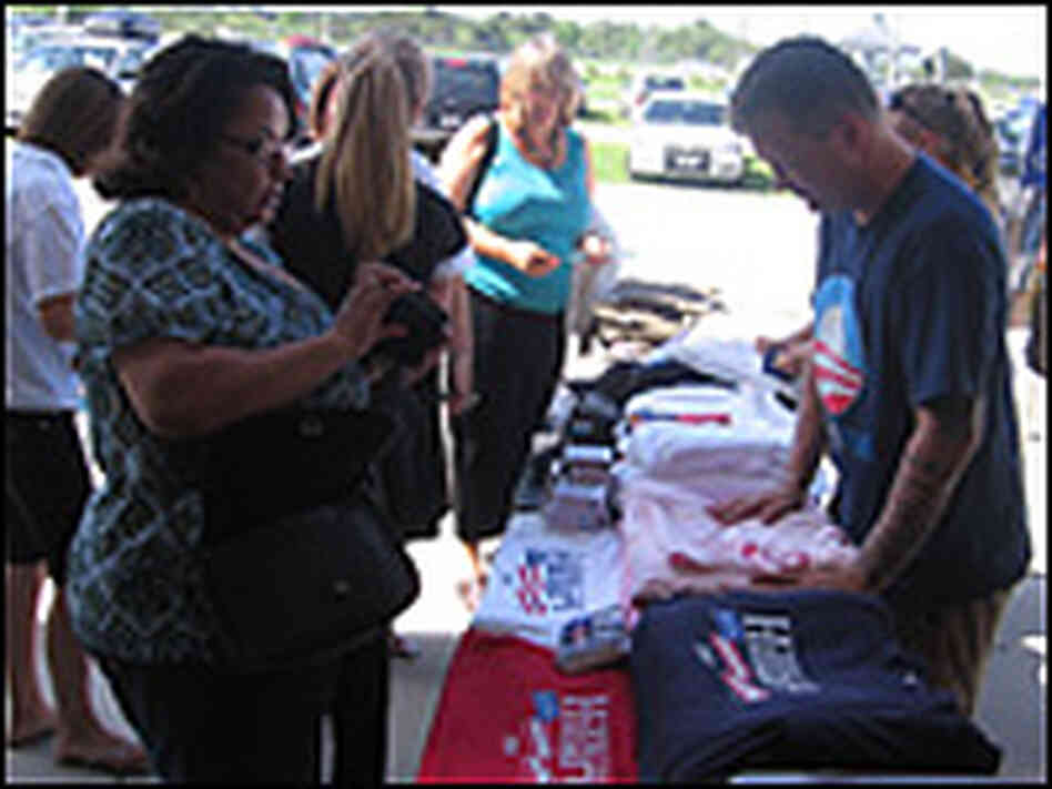 A Florida woman buys Clinton buttons at a rally for Democratic presidential nominee Barack Obama.