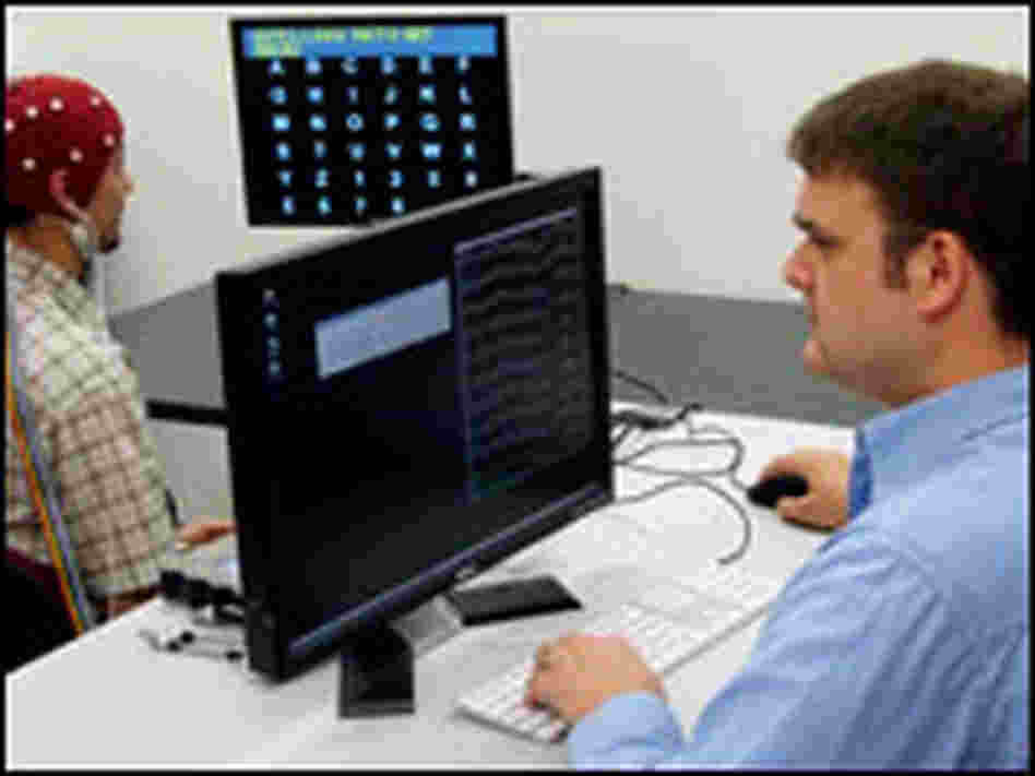 Student Adam Wilson (right) and lab member Leo Walton practice the technology.