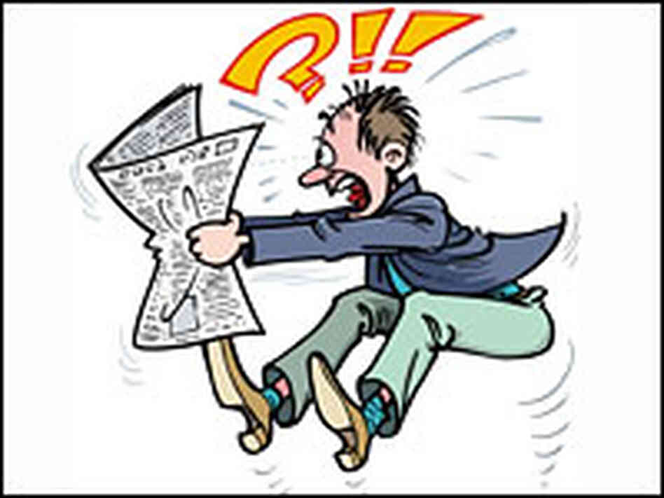 A man jumps with alarm after reading the newspaper. A man jumps with alarm after reading the newspaper.