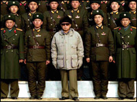 North Korean leader Kim Jong Il poses with soldiers.