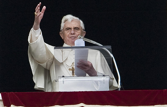 Pope Benedict XVI leads the Angelus prayer from the window of his private apartment at the Vatican.