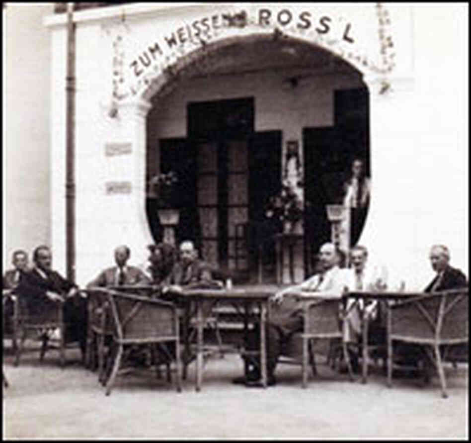 Patrons sit in the courtyard of the White Horse Inn