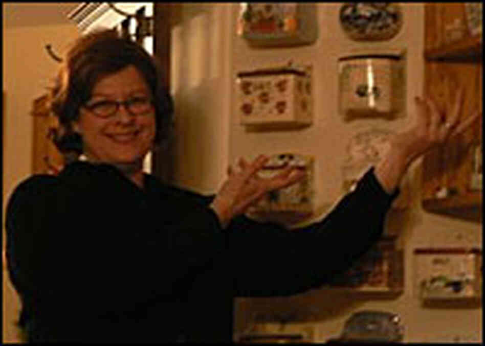 Laura Lorson with a collection of saltboxes. Laura Lorson with a collection of saltboxes.