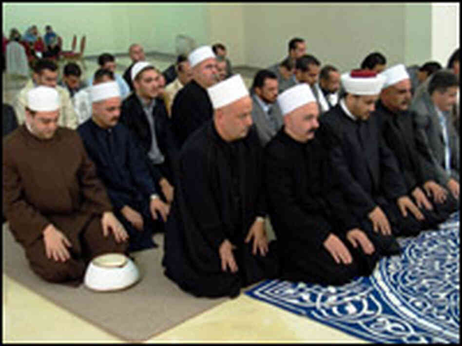 Muslim clerics pray at an interfaith service Muslim clerics pray at an interfaith service
