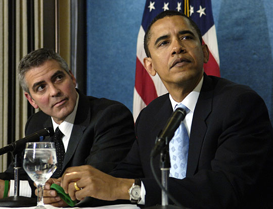 Shepard Fairey says he used this photo by Mannie Garcia, taken April 27, 2006 at the National Press Club, for the Obama 'Hope' poster. Fairey cropping out actor George Clooney and changing the tilt of Obama's head. [Ohoto by Mannier Garcia/AP/NPR]