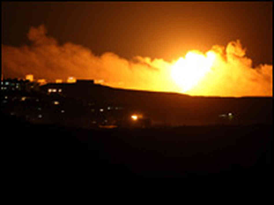 Israeli artillery fire shells into Gaza on Saturday. Israeli artillery fire shells into Gaza on Saturday.